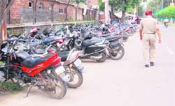 A view of an illegal parking lot located outside the premises of the district courts complex in Amritsar. 