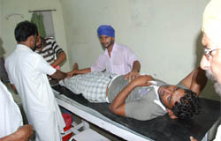 A passenger undergoes treatment at the Civil Hospital in Bathinda on Monday. 