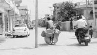 An electricty pole that stands in the middle of a road near Hem Vihar at Baltana, leading to road mishaps. 
