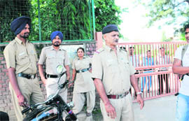 Police personnel deployed outside St Stephens School, Sector 45, Chandigarh, on Monday. 
