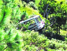 The mini bus that met with an accident in Tehri Garhwal district on Monday. 