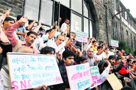 Members of the Shimla Nagrik Sabha stage a protest against the monkey menace in Shimla on Monday