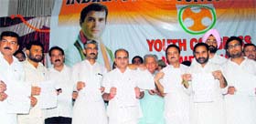 Deputy Chief Minister Tara Chand (centre) releases membership forms in Jammu on Monday.