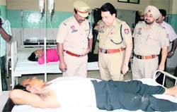 ADCP (City-1), RK Sharma, enquires about the health of the NRI couple at the Civil Hospital. 