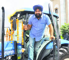 Jagmohan Singh from Moga with the air-conditioned tractor in Ludhiana.