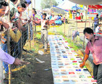 People enjoy a game at Chhappar Mela on Monday. 