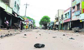 Stones and slippers lying on a road in a violence-hit locality in Paramkundi on Monday