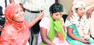Family members of the schoolchildren who sustained injuries in the mishap wait in the lobby of the Jalandhar Civil Hospital.