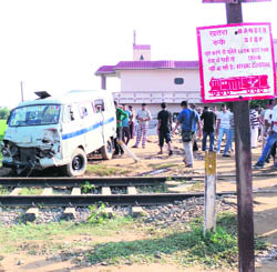 mangled remains of the school van that was hit by the train at Mauwal village in Nakodar