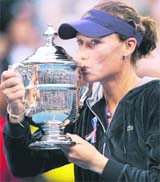 Samantha Stosur of Australia kisses the trophy after beating Serena Williams in the womens singles final at the US Open on Sunday.