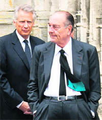 Former French President Jacques Chirac (right) and PM Dominique de Villepin have been accused of receiving suitcases stuffed with millions of francs on a regular basis from some African leaders.