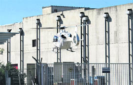 Rescuers and medics land by helicopter at the nuclear site of Marcoule in southern France on Monday