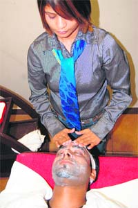 A boy gets a facial done at a beauty parlour in Amritsar