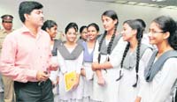DIG Alok Kumar (left) interacts with students during a traffic awareness programme at Shivalik Public School, Sector 41, Chandigarh, on Tuesday.