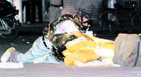 A bomb disposal personnel defuses a dummy bomb during the mock drill organised by the Chandigarh Police at Sector 22 in Chandigarh on Tuesday night.