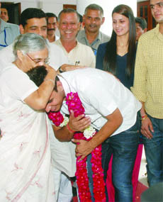 The newly-elected DUSU president of the NSUI, Ajay Chikara, meets Delhi Chief Minister Sheila Dikshit at her residence in New Delhi on Tuesday.