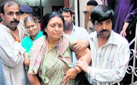 An inconsolable daughter of Kailash Bhatnagar in Dehradun on Tuesday