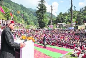 Chief Minister Prem Kumar Dhumal addresses a public meeting at Multhan in Baijnath subdivision on Tuesday