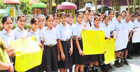 Students of British Olivia School take out a rally demanding better roads in Jalandhar on Tuesday