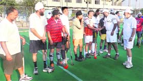 Pargat Singh, Director, Sports, interacts with veteran hockey players during the inaugural match between Jonex Club and Tracer Club at Olympian Surjit Hockey Stadium in Jalandhar