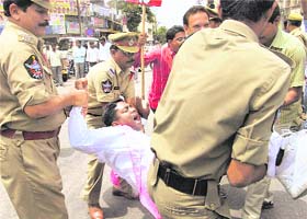 Cops detain TRS activists holding a demonstration for a Telangana state, in Hyderabad on Tuesday