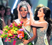 Leila Lopes of Angola being crowned winner by outgoing titleholder Ximena Navarrete of Mexico during the Miss Universe pageant in Sao Paulo on Monday. The first runner-up was Olesia Stefanko of Ukraine and the second runner-up was Priscila Machado of Brazil. Indias Vasuki Sunkavalli failed to make it to the final 16