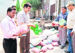 MC health officials confiscate substandard polythene carry bags from a supplier in Amritsar on Wednesday. 