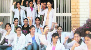 Students of Dhanwantry Ayurvedic College, Sector 46, shout slogans on the college premises in Chandigarh on Wednesday.  