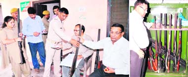 Rajaji National Park forest employees deposit their weapons as a mark of protest at the forest range office in Haridwar on Wednesday