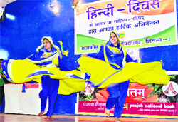 Girls present an item during a cultural function on the occasion of Hindi Diwas at Rajkiya Kanya Mahavidyalaya in Shimla on Wednesday