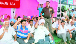 Members of the BSNL Employees Union stage a dharna in Jalandhar on Wednesday