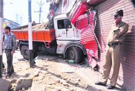 A truck that crashed into a shop in the Magharmal Bagh area in Srinagar on Wednesday. No one was injured in the accident.