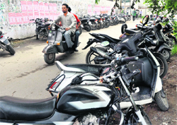 Vehicles of students and staff parked outside GGN Khalsa College in Ludhiana