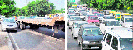 A car driver tries to make his way past a stationary truck-trailer from the road divider near the PAU gate number 2 on the Ferozepur road; and (right) a long queue of vehicles caused by the stationary truck-trailer