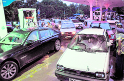 As the news about the petrol price hike spread, a rush of commuters can be seen at a petrol pump in Sector 21, Chandigarh, on Thursday
