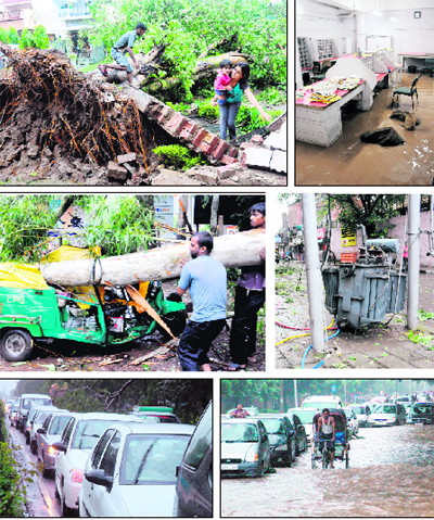 A woman carrying a child walks past an uprooted tree that damaged a wall after a squall hit Sector 21; Furniture and bags are ankle-deep in rainwater that entered the General Post Office in Sector 17; A transformer that fell to the ground in Sector 22; Vehicles caught on a waterlogged road in Sector 19; Vehicles move slowly as a damaged tree blocks a portion of a road in Sector 34; and A man tries to remove a tree that came crashing down on an auto-rickshaw at a filling station in Sector 21, Chandigarh, on Thursday