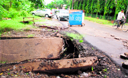 The part of a road where sewerage caved in following rain at Industrial Area, Phase VIII, in Mohali on Thursday