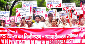Activists of the CPI shout anti-Delhi government slogans during a protest against the proposed privatisation of water distribution, near the Delhi Jal Board office in New Delhi on Thursday. 