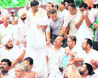 Congress leader Sukhdev Singh Shahbazpuri involved in an altercation with another party leader during a protest rally in Amritsar 