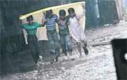 Children enjoy rain in Civil Lines, Ludhiana