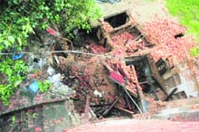A view of the collapsed building at Bansanwala Bazaar area.