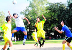 Players of Akranta Club (in blue) and Gypsy Young (in yellow) in a match in the Doon Callisto Cup tournament played in Dehradun