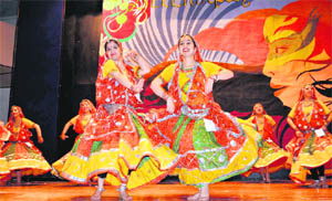 Girls present an item during an inter-college competition at St. Bedes College in Shimla 
