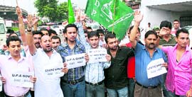 Activists of the PDP protest against the petrol price hike inJammu on Friday. 