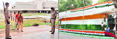Cops stand guard as the GDMC ground is readied in Ahmedabad for Narendra Modis fast; and (right) Gandhi Ashram of Ahmedabad where Congress leader Shankar Singh Vaghela will hold fast