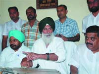 Sardoolgarh MLA Ajit Inder Singh Mofar flanked by MLA Ajaib Singh Bhatti and Congress district president (Urban) Ashok Kumar addresses a joint press conference in Bathinda on Saturday