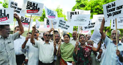 Members of the United Residents Welfare Associations stage a protest against the power tariff hike at Jantar Mantar in New Delh