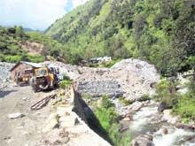 The muck and debris dumped by power projects at Shamshar village inside the Great Himalayan National Park.