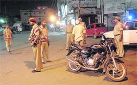 Cops during a special night vigil to nab members of the Bikers gang in Jalandhar on Saturday
