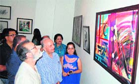 SS Bloeria, Vice-Chancellor of the Central University of Jammu, looks at a painting at Kala Kendra in Jammu on Saturday.